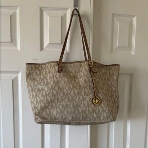 Michael Kors Cream Tote Bag with Monogram Pattern and Leather Straps